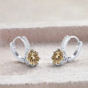 Detail of S925 silver earrings featuring 2ct champagne stones in six-prong setting