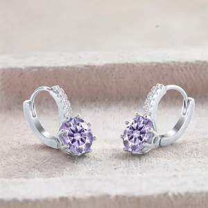 Macro shot of S925 sterling silver stamp on earrings with oval purple gemstones