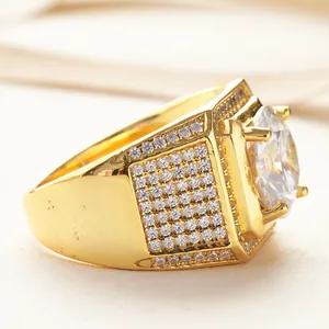 Macro detail of men's wide gold-plated ring with large round moissanite center stone