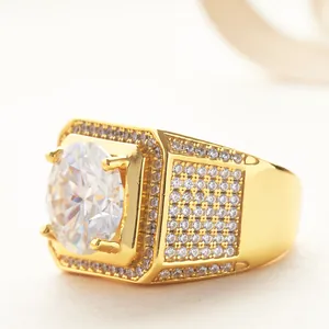 Close-up of hip-hop men's gold ring featuring a large round moissanite and micro-pave diamonds