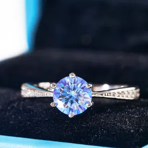 S925 sterling silver ring with 6-prong blue moissanite and side diamonds in jewelry box