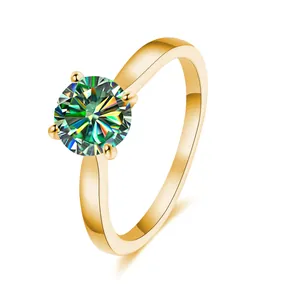 Detailed macro view of 2ct round moissanite ring with gold four-prong setting and fire brilliance