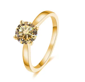 Macro shot of 2 carat yellow moissanite ring with four-prong setting in gold finish