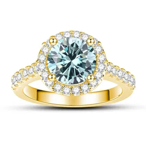 Macro detail of round cut halo moissanite ring with pave set stones on a golden band