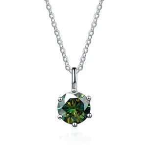 Macro shot of dark green moissanite pendant with classic six-prong setting detail