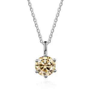 Macro shot of 6-prong champagne moissanite pendant with elegant silver cross chain link