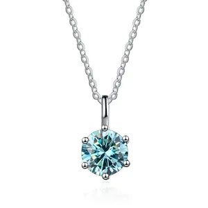 Elegant classic six-prong solitaire necklace featuring light blue round moissanite