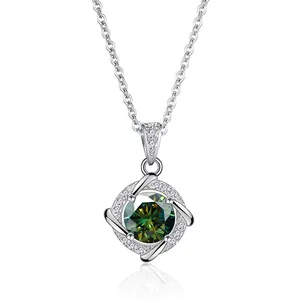 Macro detail of silver necklace with round green moissanite in twisted diamond frame