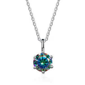 Macro shot of 6-prong silver necklace with large round iridescent moissanite pendant