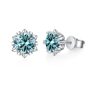S925 sterling silver snowflake stud earrings featuring a round blue moissanite center