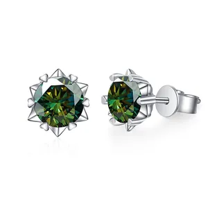 Macro shot of silver stud earrings featuring green moissanite with heart-shaped prongs