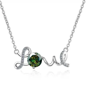 Macro view of S925 silver Love pendant featuring a brilliant green Moissanite stone