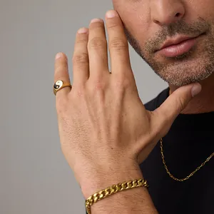 Men's gold stainless steel jewelry set featuring Yin Yang Tai Chi ring and Cuban chain bracelet