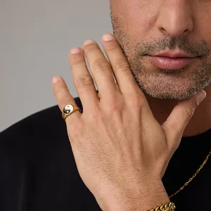 Close-up of gold stainless steel signet ring with black and white Tai Chi Yin Yang design