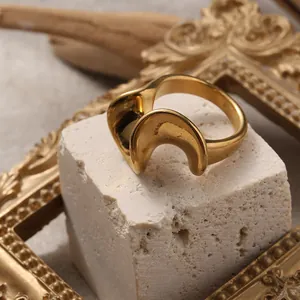 Macro shot of 18K gold plated stainless steel ring with irregular wave design