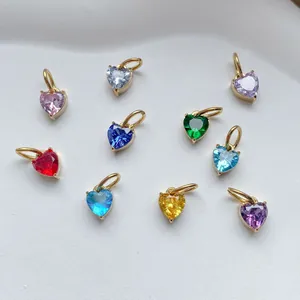 Detail showing heart-shaped colorful zircon pendants with gold plated metal settings