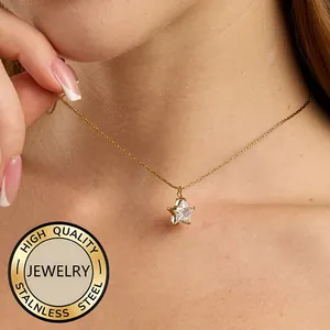Elegant 18K gold plated stainless steel star necklace with crystal on woman's neck