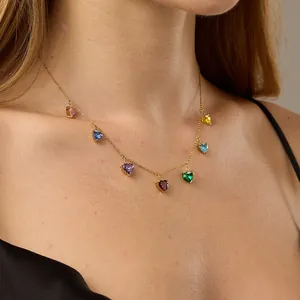 Close-up of heart-shaped multi-color zircon pendant necklace on female model neck
