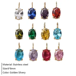 Détail de 12 pendentifs en zircone ovale colorée avec monture en acier inoxydable doré