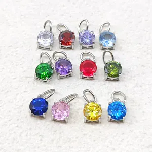 Set mit 12 bunten runden Zirkon-Anhängern und 18K vergoldeten Charms in verschiedenen Farben