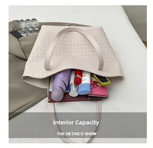 Macro view of woven tote bag interior showing large capacity for daily essentials