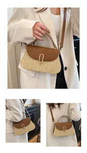 Detail of woven straw handbag with brown leather flap and gold metal circular lock