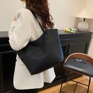 Large black woven tote bag with geometric texture for women's daily commute and fashion