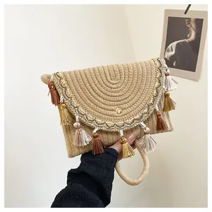 Detailed close-up of bohemian woven saddle bag with colorful tassels and gold embroidery