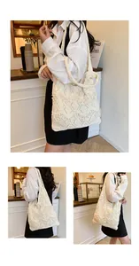 Detail of hand-woven cream tote bag with elegant pearl embellishments and long shoulder strap
