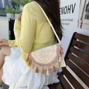 Woven saddle bag with colorful wave patterns and tassels for spring beach vacations