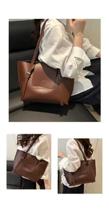 Detail view of large brown tote bag showing smooth leather texture and refined flap design