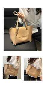 Detail of adjustable shoulder strap and metal buckle on beige vintage tote bag