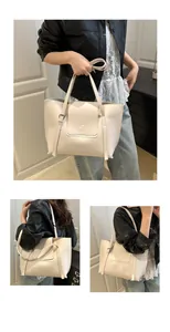 Detail view of a beige large tote bag with smooth PU leather and stylish buckle