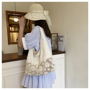 Detailed side view of canvas tote bag featuring 3D lace flower crochet and vintage style