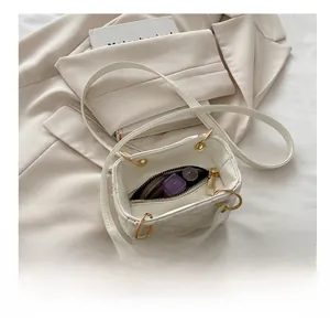 Interior view of beige quilted mini bag with gold hardware showing lipstick storage
