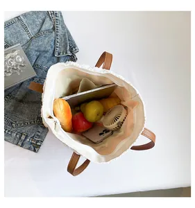 Top view of woven tote interior showing spacious storage for daily essentials
