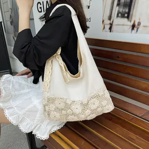 Large cream canvas tote bag with floral lace trim and bow handle for beach vacation