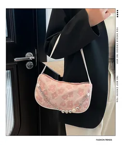 Pink floral shoulder bag featuring a silver metal chain with pearls and metallic beads