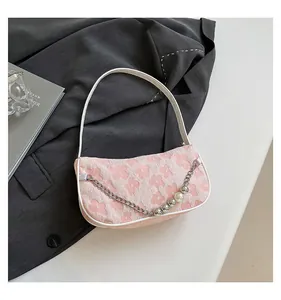 Pink floral jacquard shoulder bag with pearl accents and silver chain detail