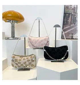 Three textured floral small square bags in khaki, pink, and black with pearl chains