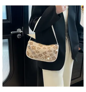 Floral shoulder bag featuring vintage flower prints with pearl and silver chain details