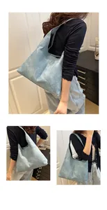 Detail view of light blue textured hobo tote bag with vintage washed faux leather finish