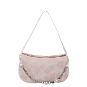 Pink floral shoulder bag with white leather strap and pearl chain decoration