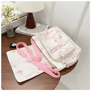 Detail of a floral crossbody bag with butterfly prints on a wooden table with soft lighting