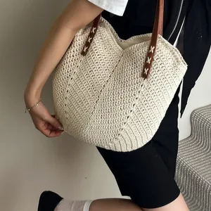 Chic beige woven crochet beach tote bag with dark brown leather straps for summer