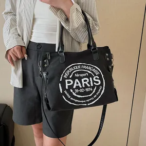Retro black canvas tote bag with Paris airport print and adjustable leather strap