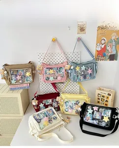 Multiple colors of large capacity ita bags with clear PVC window and plush charm