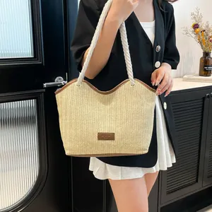 Retro woven straw tote bag with brown leather trim and white cotton rope handles
