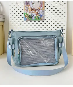 Detail of light blue ita bag showing large transparent window for badge display