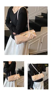 Detailed views of a pink baguette bag with silver bows and lace pearl accents